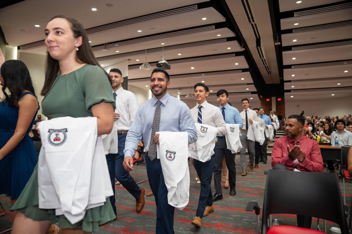 Dental students receiving their white coats at the Texas Tech University Health Sciences Center El Paso Woody L. Hunt School of Dental Medicine