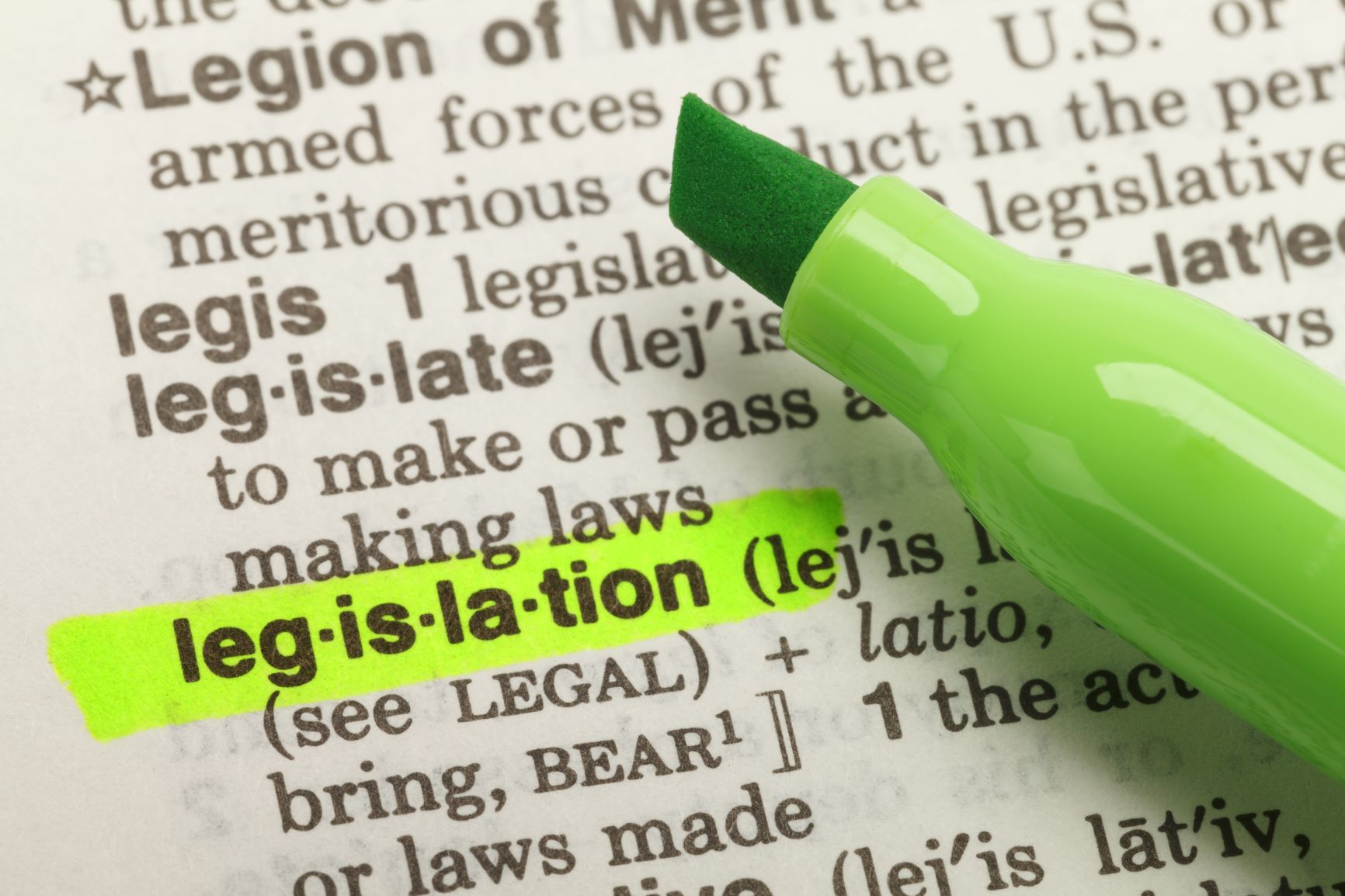 The word "legislation" highlighted in a dictionary with a highlighting marker